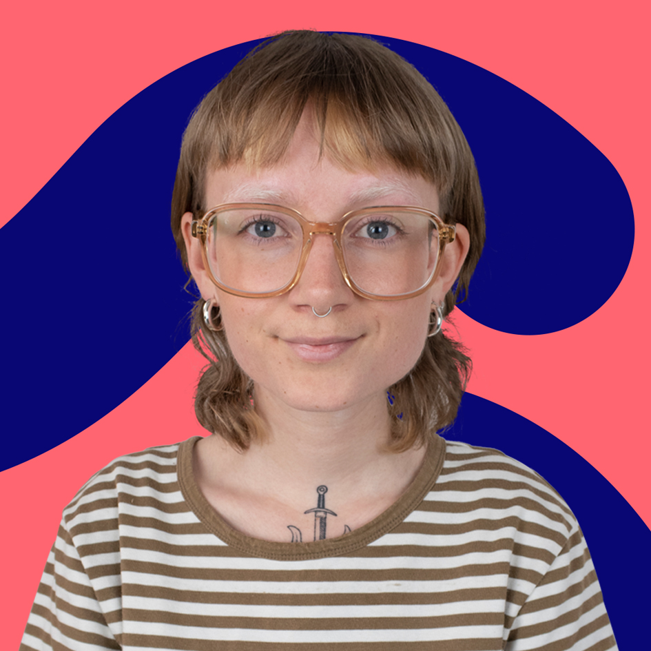 A young woman with short brown hair and round glasses, wearing a striped shirt. she has a small anchor tattoo on her neck, set against a pink and blue graphic background.