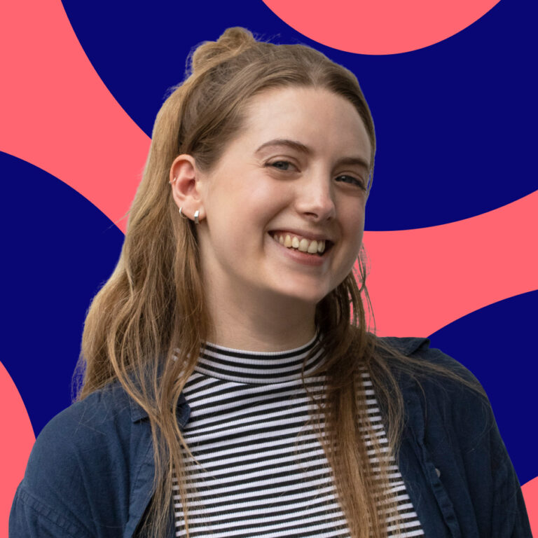 A young woman with long hair styled in a half-up, half-down hairstyle, smiling brightly. she wears a striped top, set against a vibrant blue and pink abstract background.